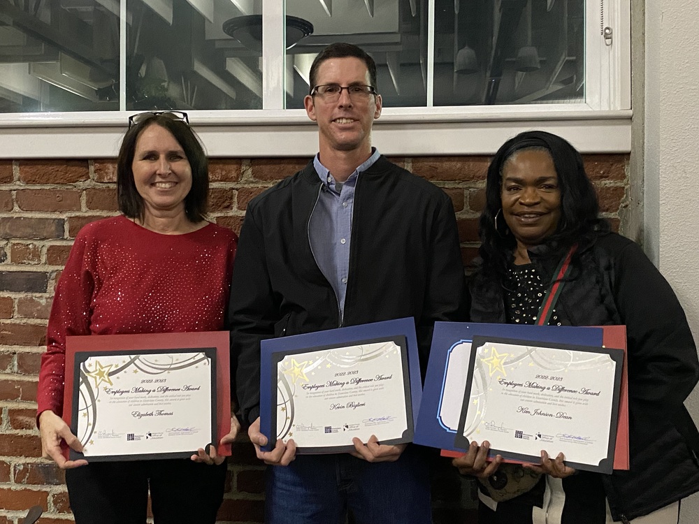 Elizabeth Thomas, Kevin Biglieri, and Kimberly Johnson-Dean are all smiles holding their Employees Making a Difference certificates