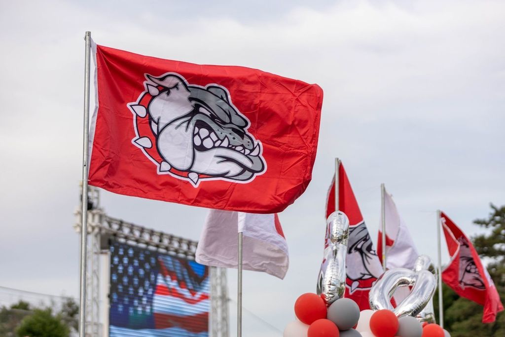 Image of red flag with bulldog logo. 