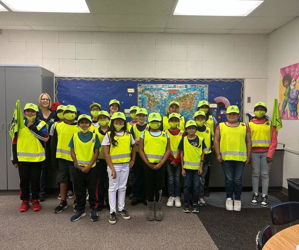 students in neon traffic patrol uniforms ready to keep school safe