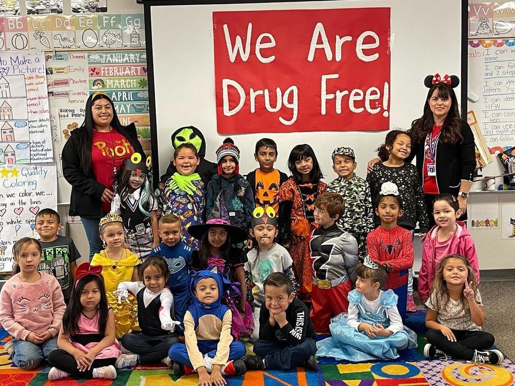 students dressed up as disney characters in classroom