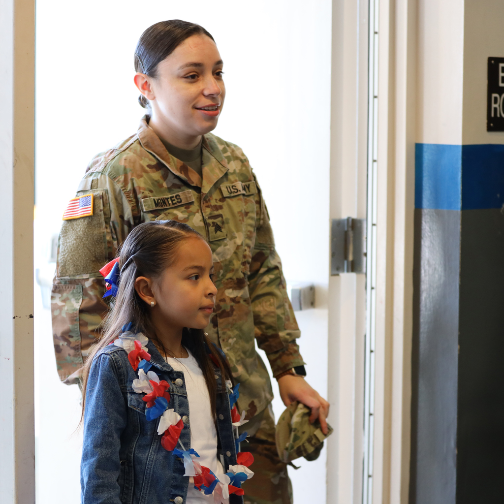 Student and female veteran enter school cafeteria