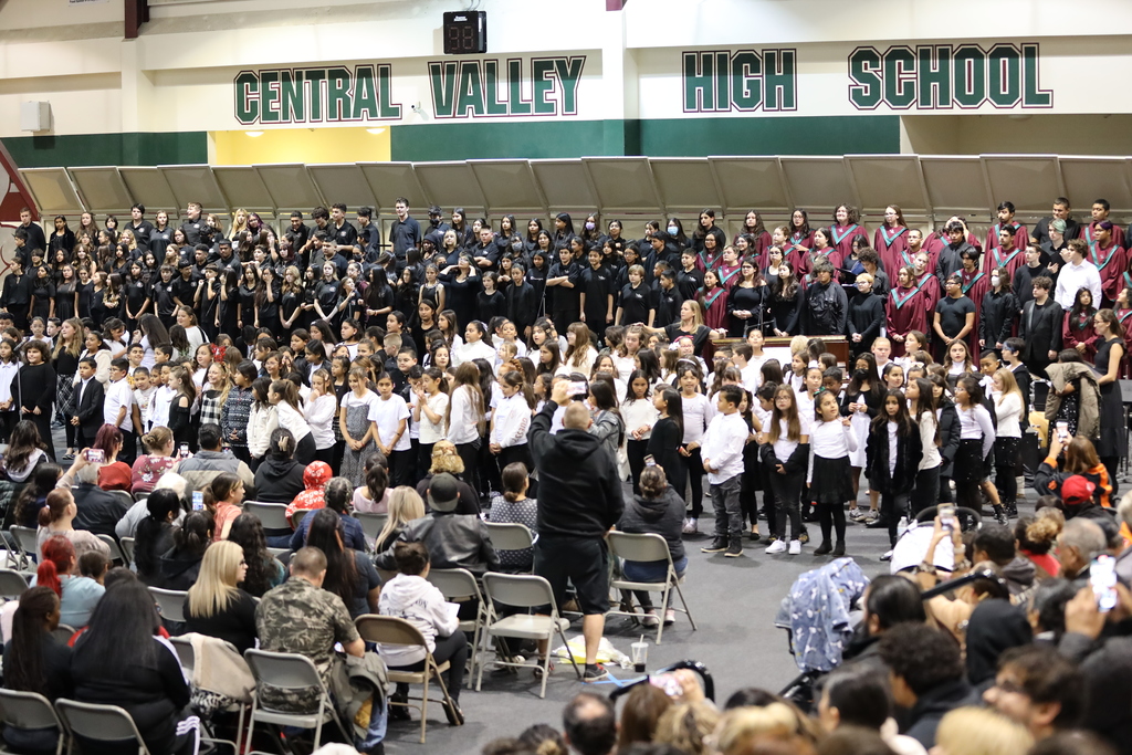 An audience watches elementary and secondary choral students sing