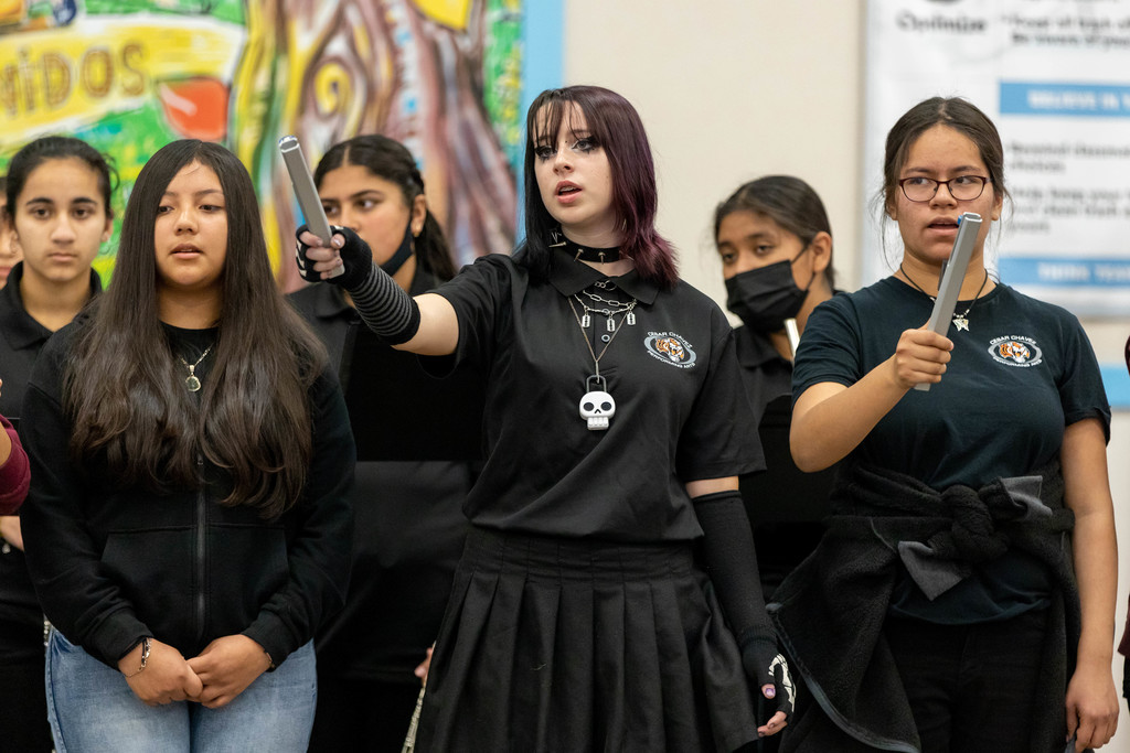 Six junior high choir students performing