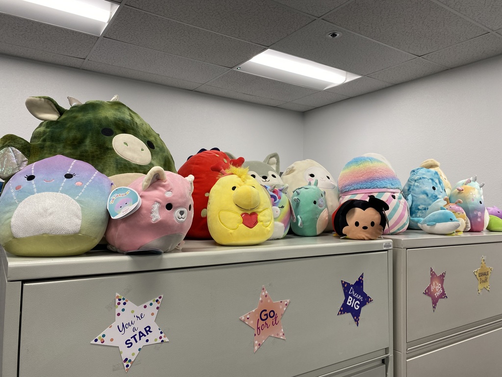 Squishmallows atop two filing cabinets