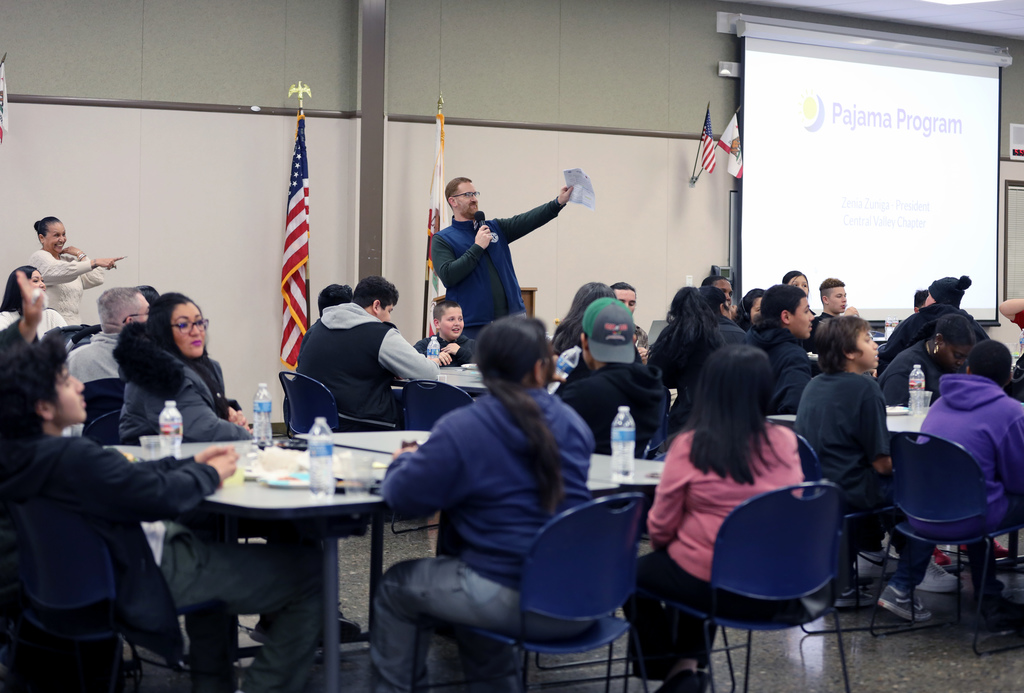Presenter points toward audience