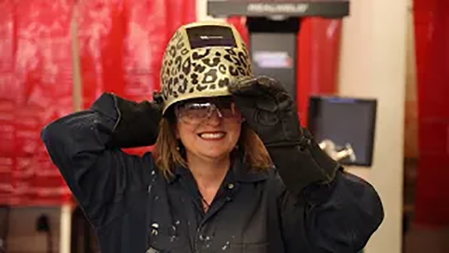 Denise Wickham in leopard welding helmet