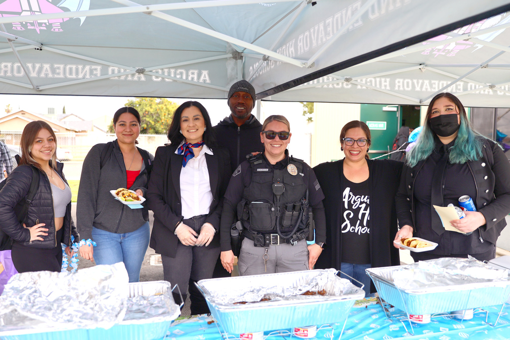 Students, staff, and the school SRO at a taco bar