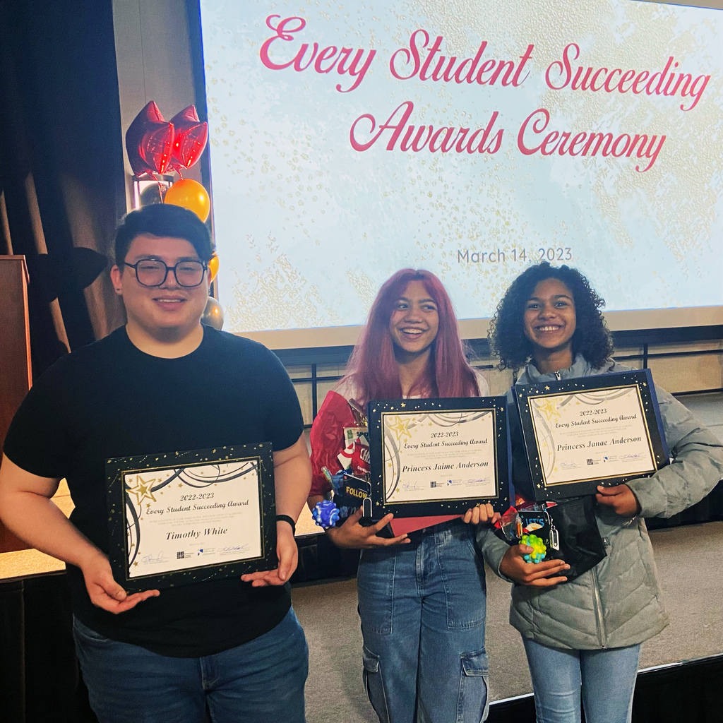 Three student honorees pose with certificates