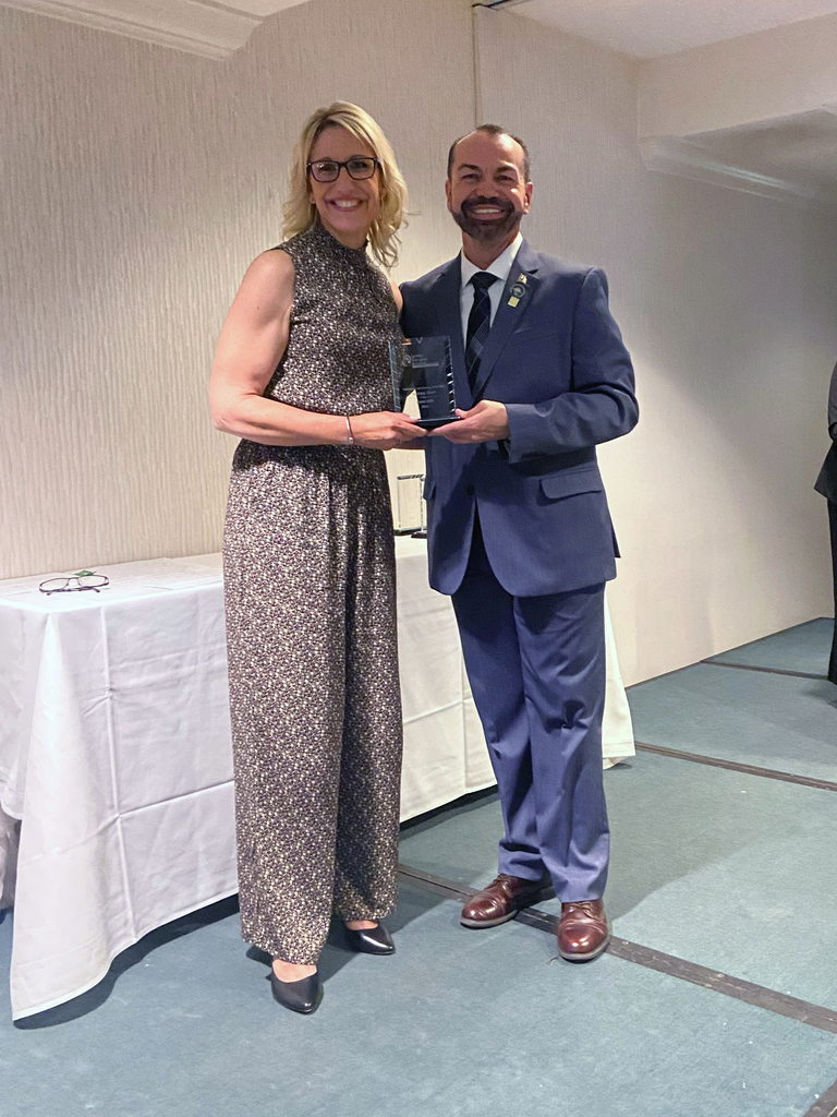 Ashley Grim accepts award