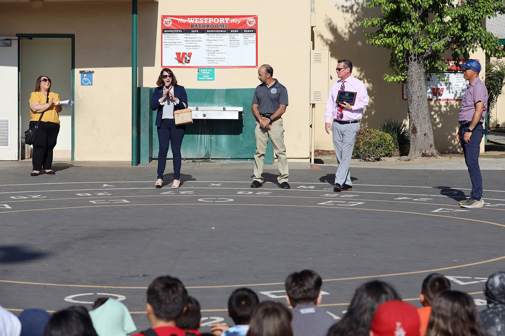 Principal and district leaders with Mr. Ruben