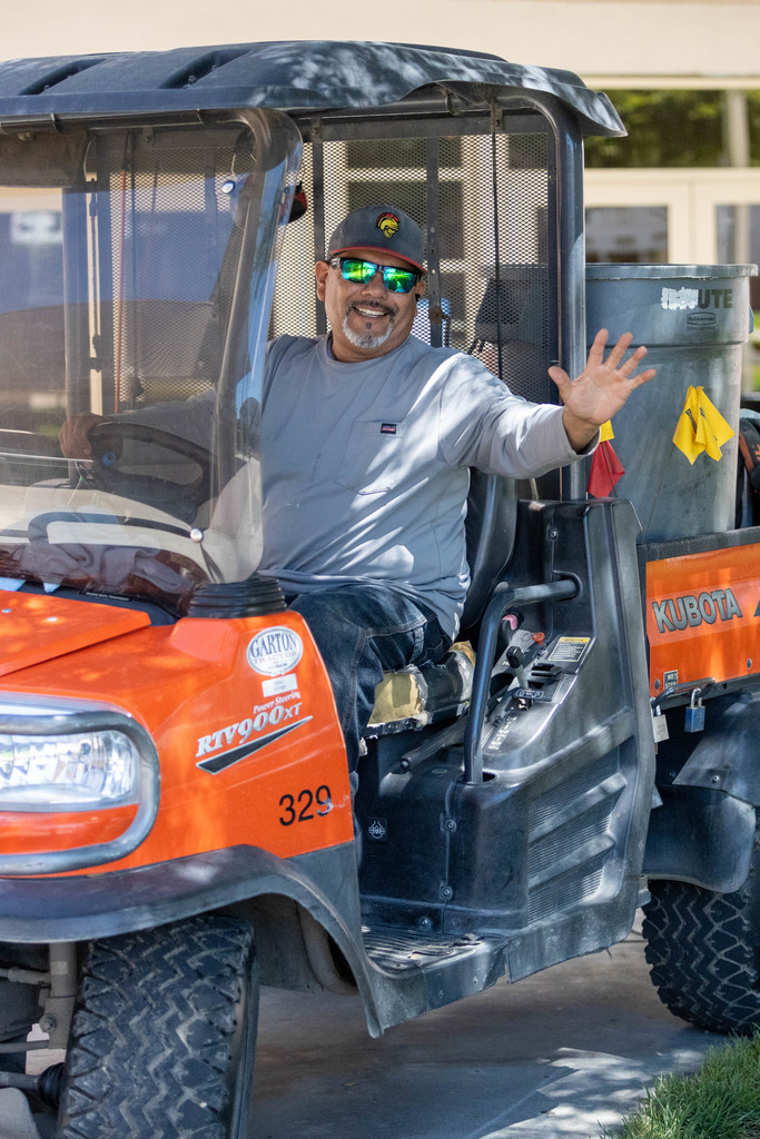 Smiling employee drive Gator
