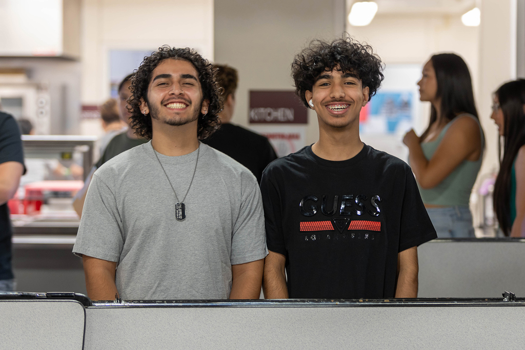 Two smiling CHS students in  cafeteria
