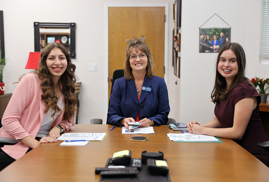 New student reps and Dr. Wickham seated at conference table