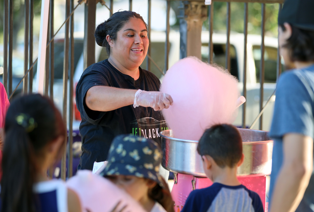 Families and students line up for cotton candy