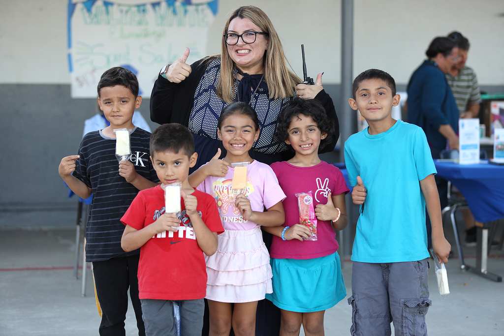 Walter White Principal and students with thumbs-up and ice cream