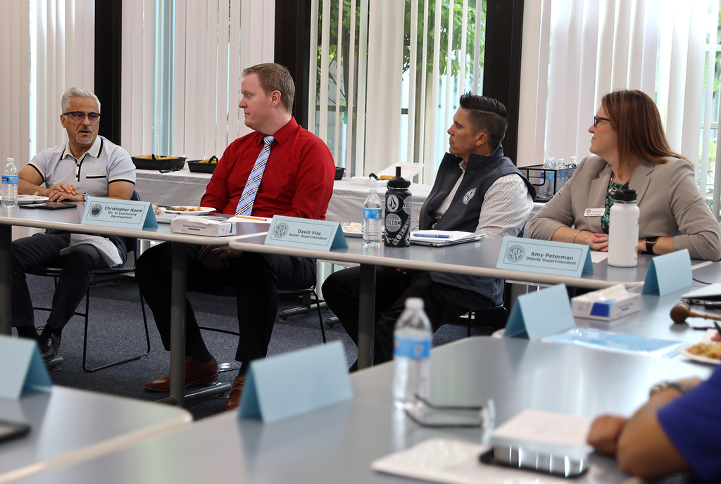 City staff leads a conversation as three other participants listen